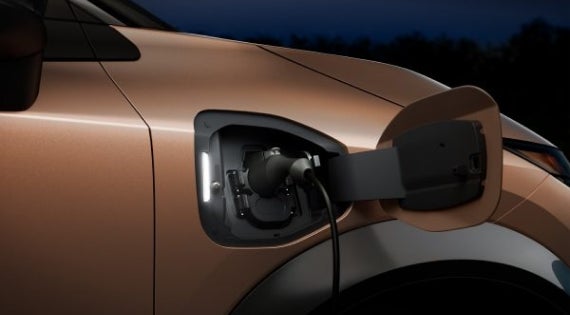 Close-up image of charging cable plugged in | Ed Martin Nissan in Indianapolis IN